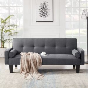 Dark gray tufted fabric loveseat with bolster pillows